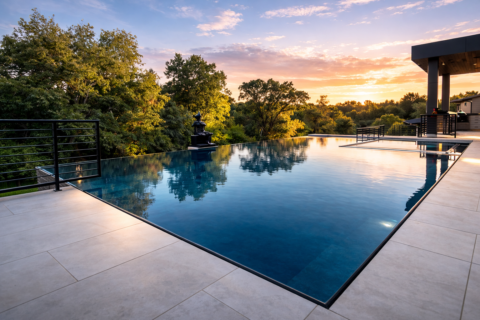 Condor infinity pool at sunset with three-sided infinity edge and EcoFinish mirror finish, pavilion with underground equipment room