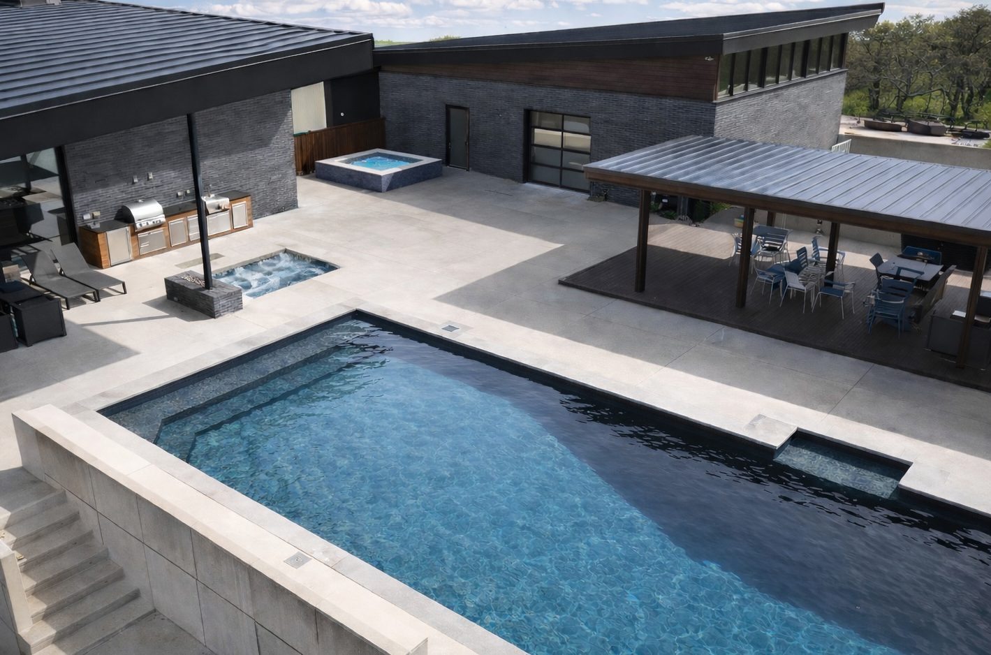 Renolit PVC membrane pool finish with modern dark brick home and outdoor living space